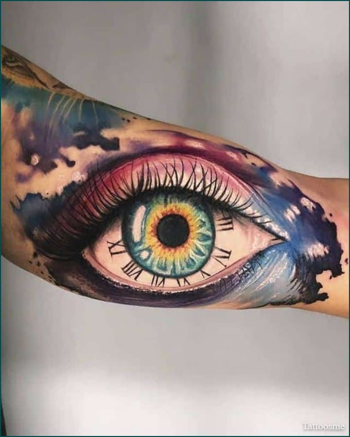 watercolor eye tattoo on inner bicep tattoo