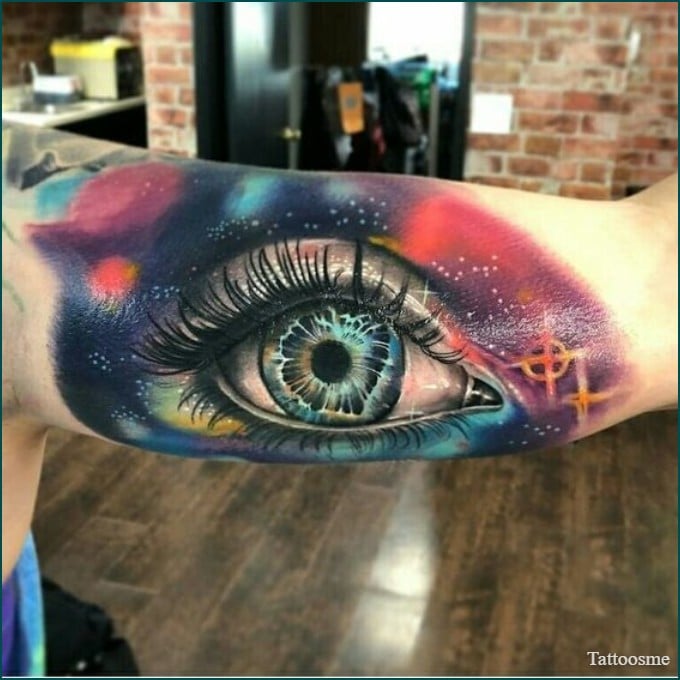 3d realistic watercolor eye tattoo on inner bicep