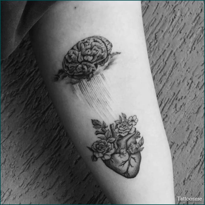brain and heart inner bicep tattoo