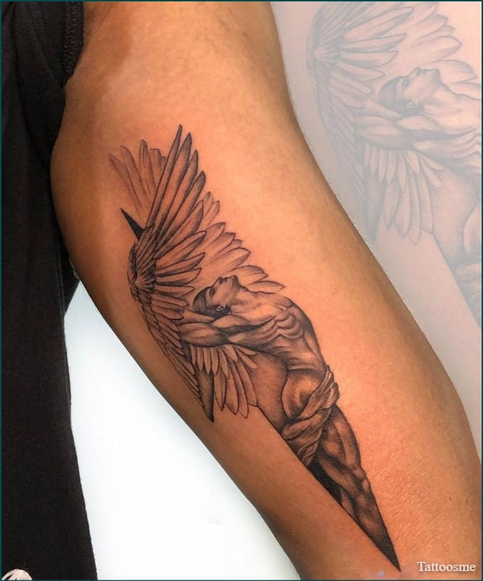 angel wings tattoo on inner bicep tattoo