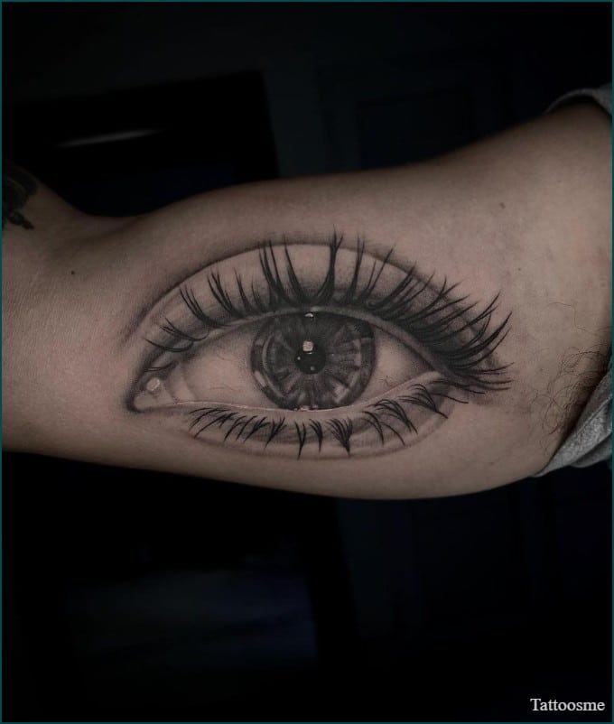 eye inner bicep tattoo