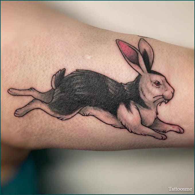 animal inner bicep tattoo