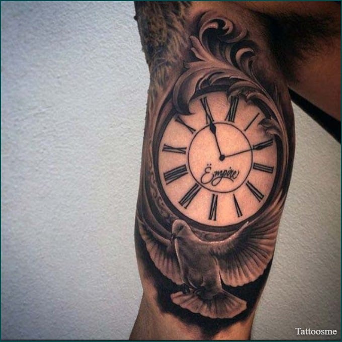 dove and clock tattoo on inner bicep