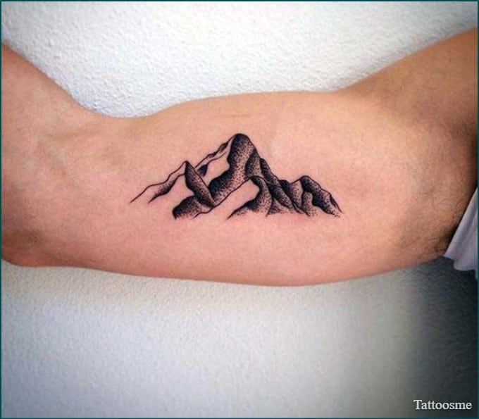 Mountain tattoo on inner bicep