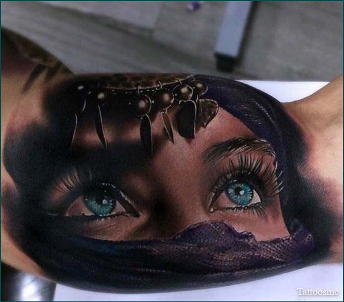 realistic eye tattoo on inner bicep