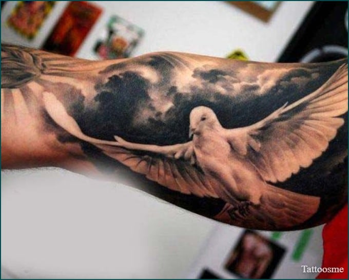 flying dove on inner bicep tattoos