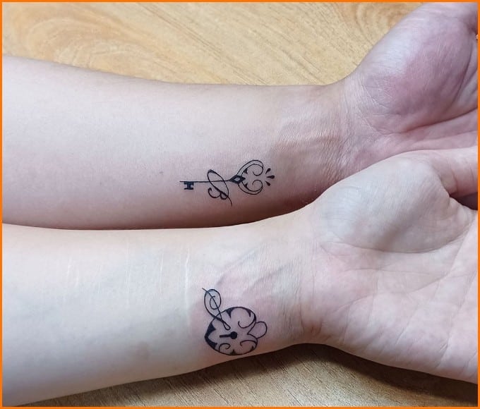 lock and key tattoos on wrist for couple