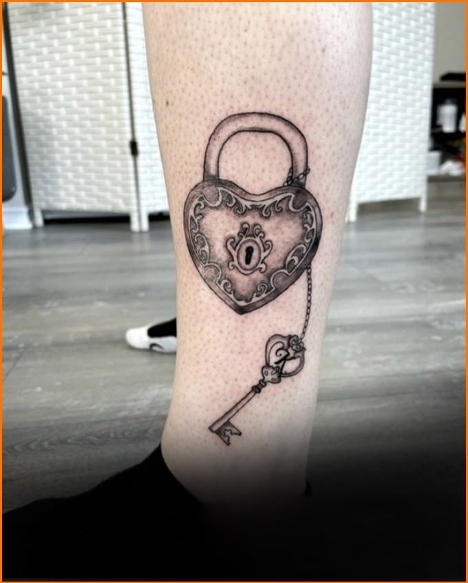 lock and key tattoos on legs