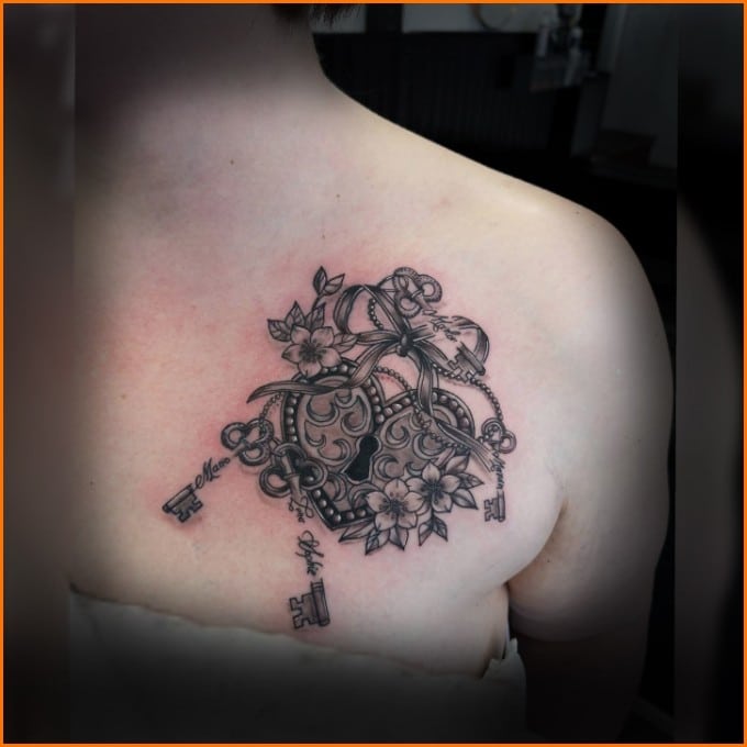 lock and key tattoos on chest for women