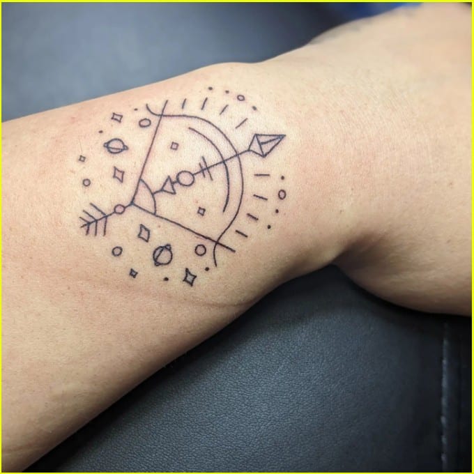 Sagittarius symbol tattoos on wrist