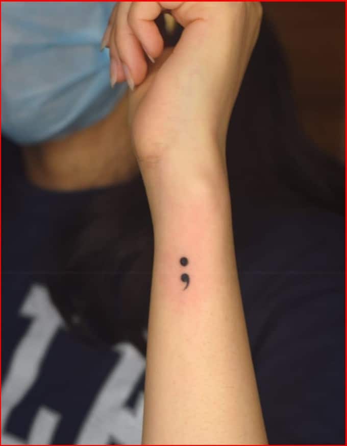 semicolon wrist tattoo 
