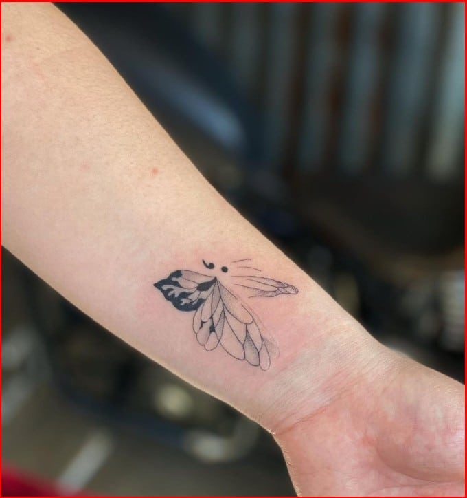 butterfly semicolon tattoo on wrist for girls