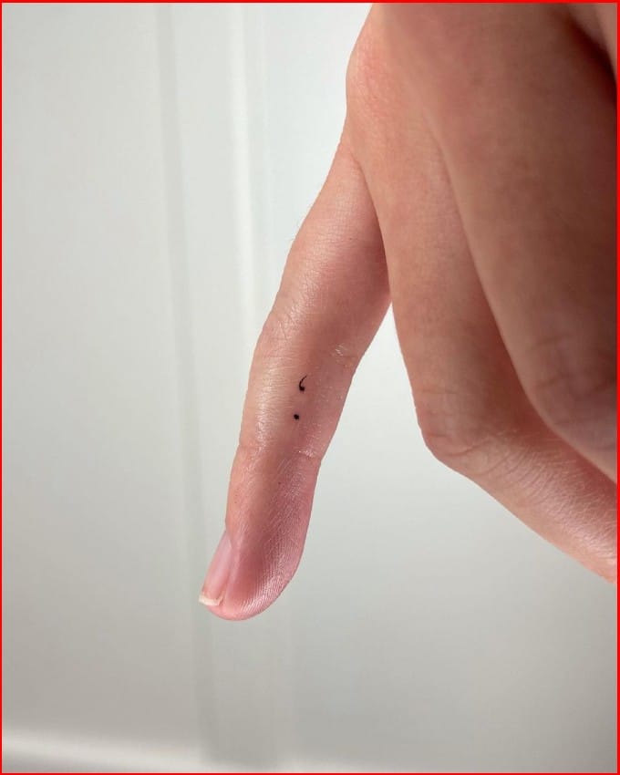 tiny semicolon tattoos on finger