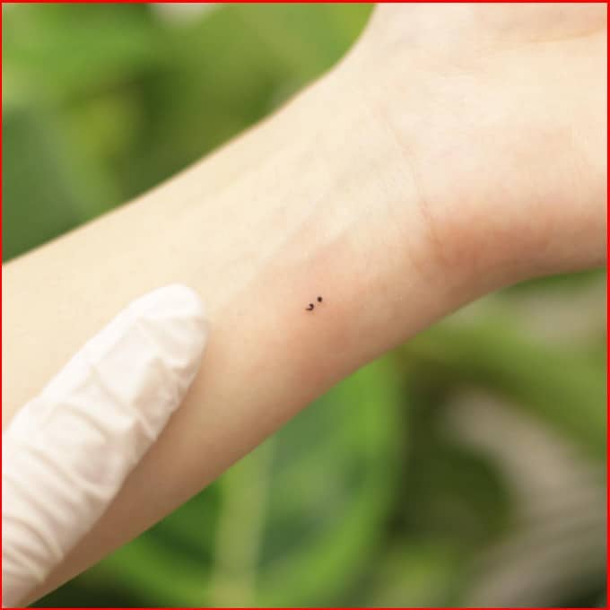 tiny semicolon tattoos on wrist