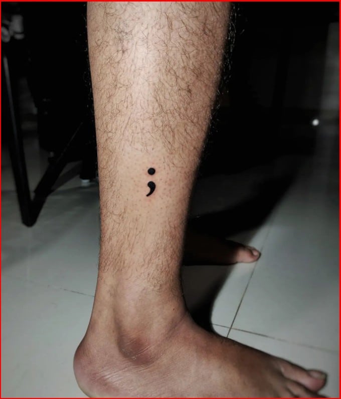 semicolon tattoo on legs