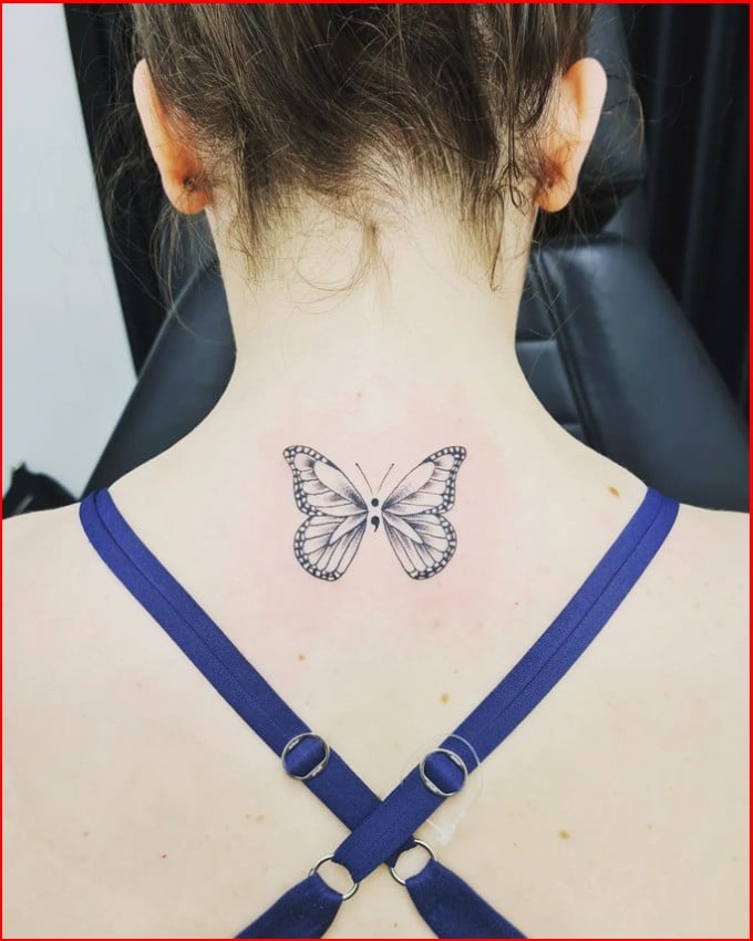 butterfly semicolon tattoo on neck