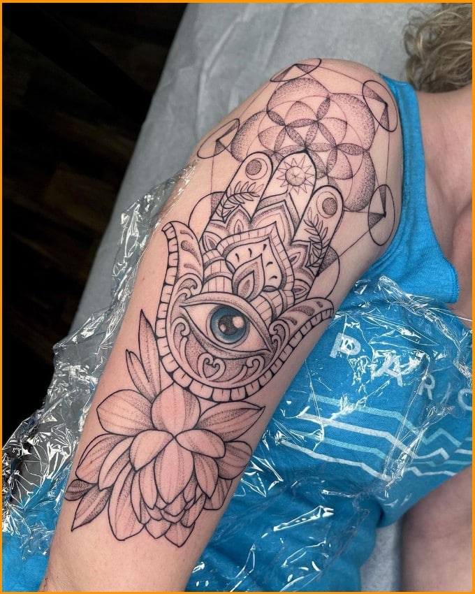 hamsa hand with eye tattoo in palm