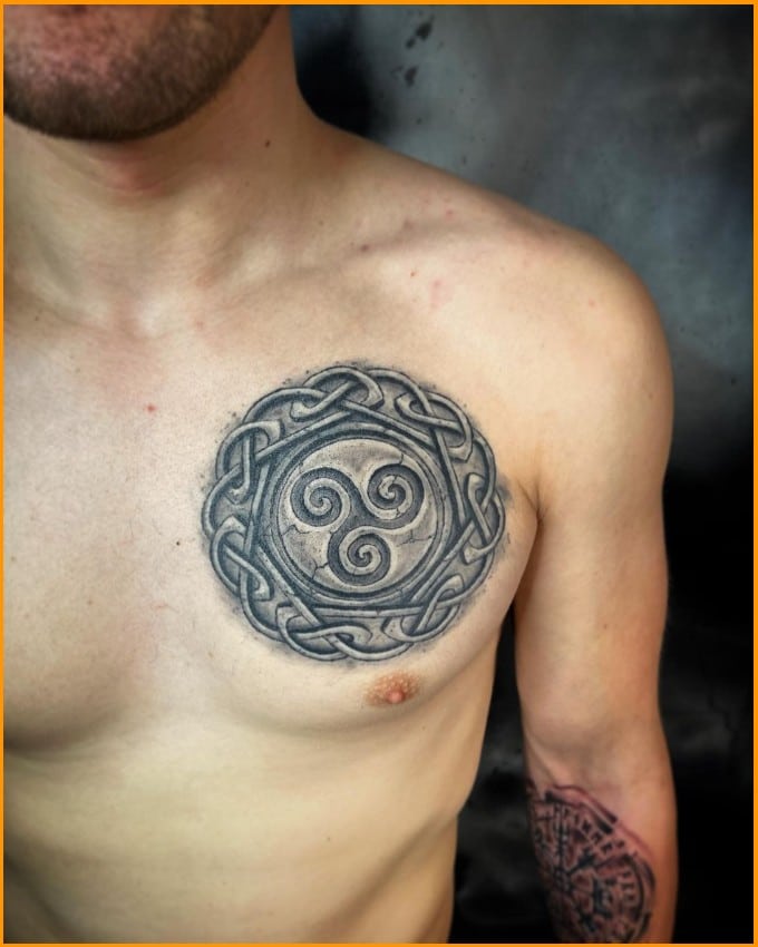 spiral chakra spiritual tattoo on chest