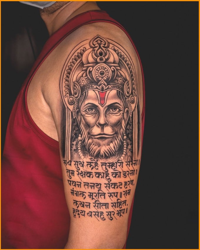lord hanuman with mantra tattoos on arms