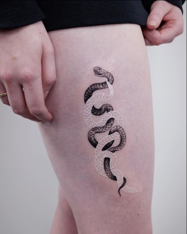 Intricately Intertwining Snake Tattoos Using Black and White Ink