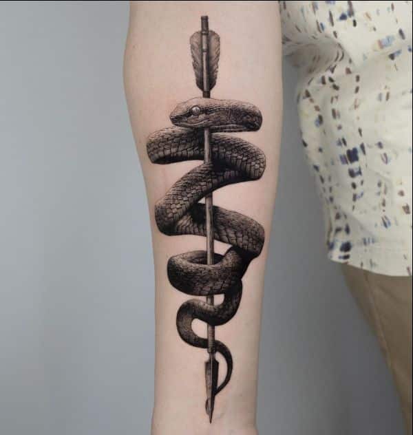 snake with arrow arm tattoos