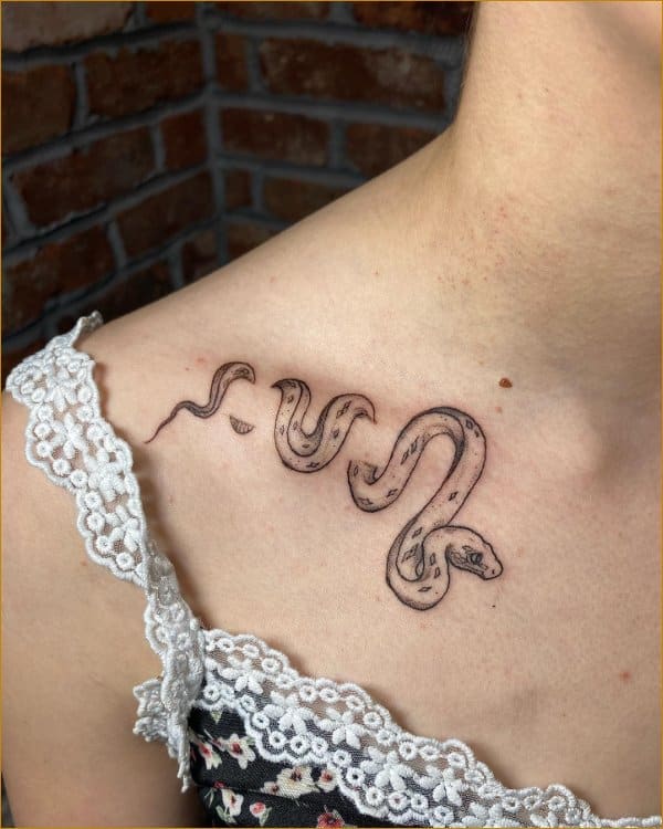 Best snake on collar bone tattoos