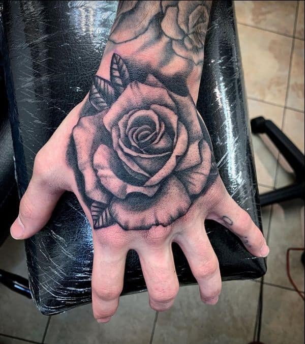 rose hand tattoo men with skeletonTikTok Search