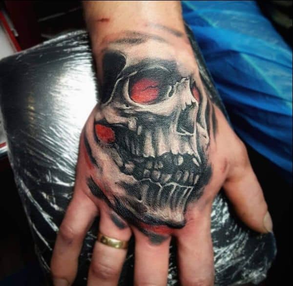 small skull tattoo design for hands