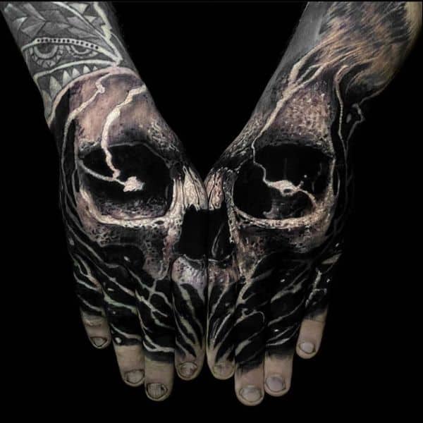 skull hand tattoos