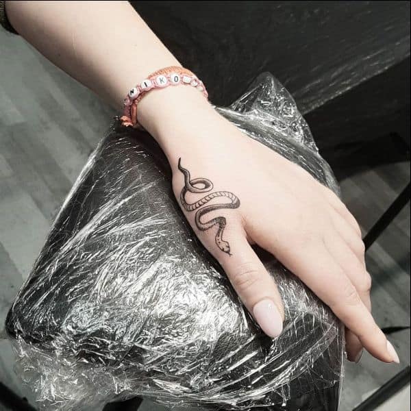 snake hand tattoos