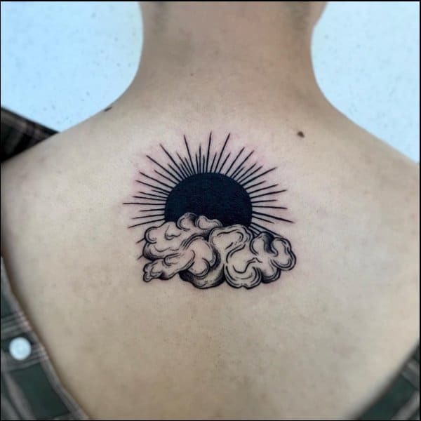 black and grey sun tattoo