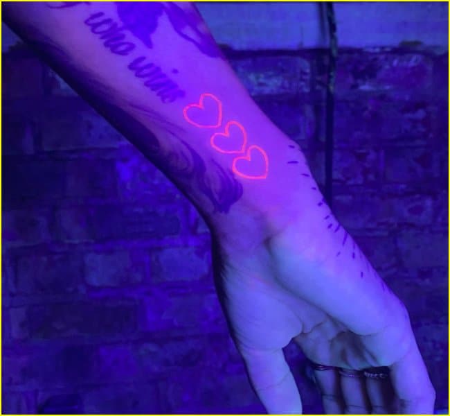 uv wrist heart tattoo