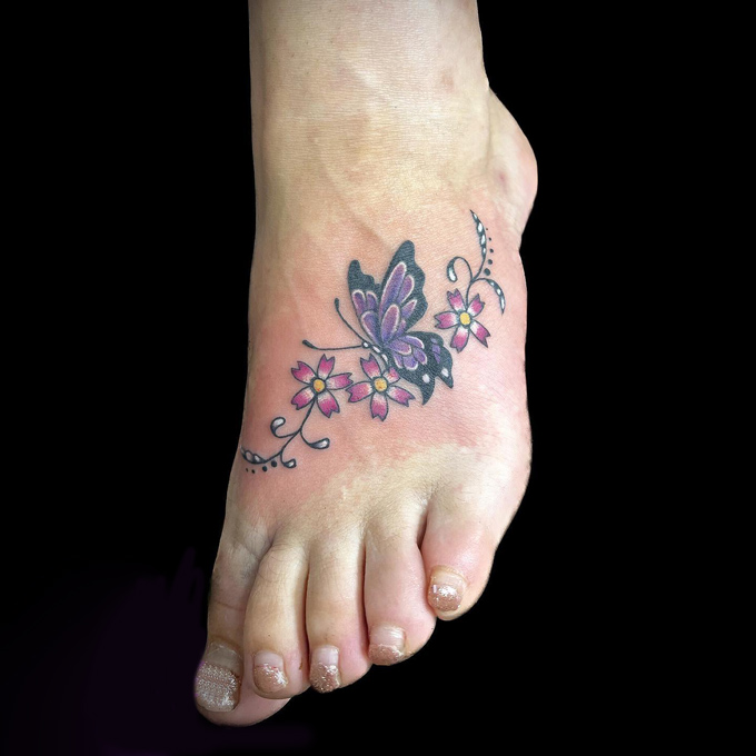 butterfly tattoo on foot 