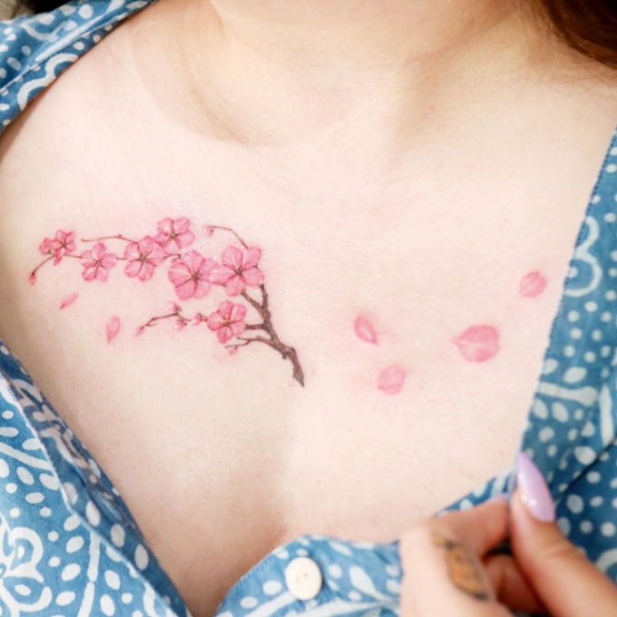 cherry blossom tattoo on chest for women