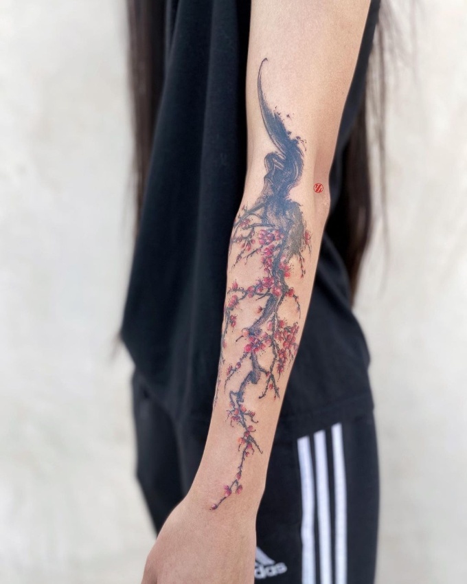 cherry blossom tattoo on forearm