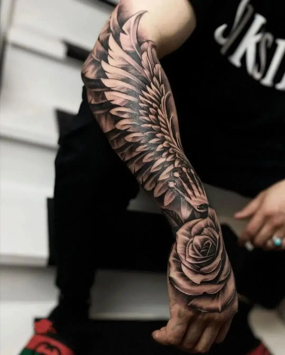 wings forearm tattoos for men