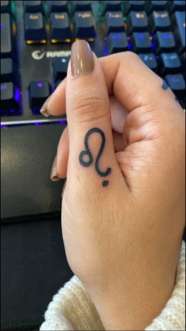 leo tattoo on thumb