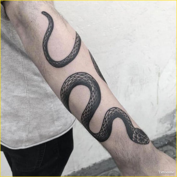 snake wrapped around arm tattoo 