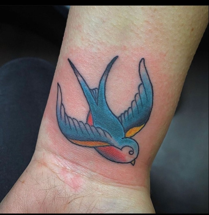 colorful sparrow tattoo design for wrist