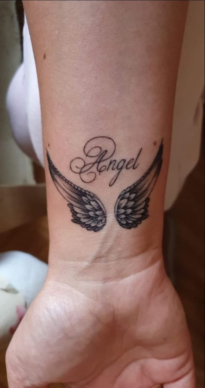 angel and wings wrist tattoos