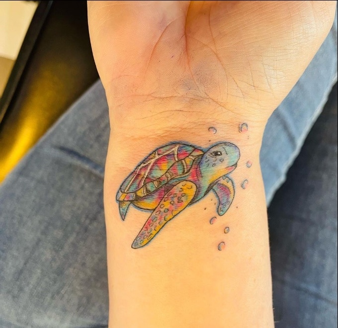 small tortoise wrist tattoos