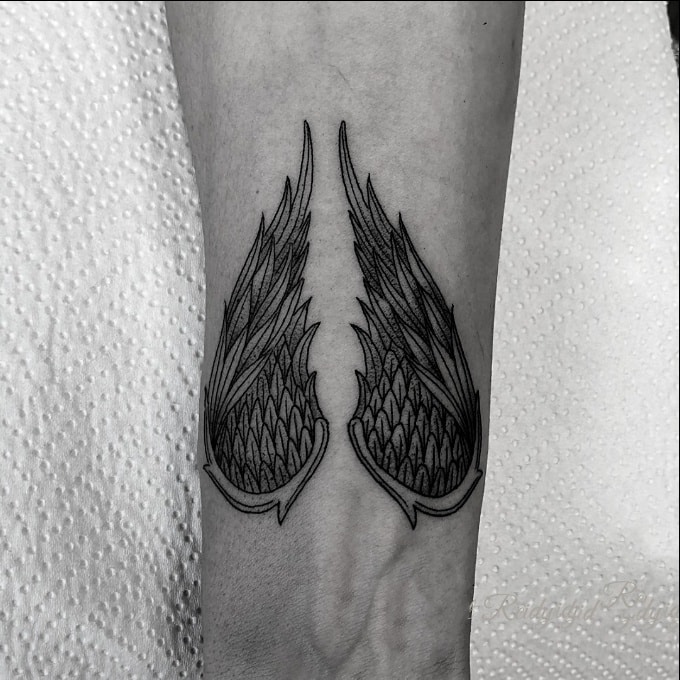 wings wrist tattoos