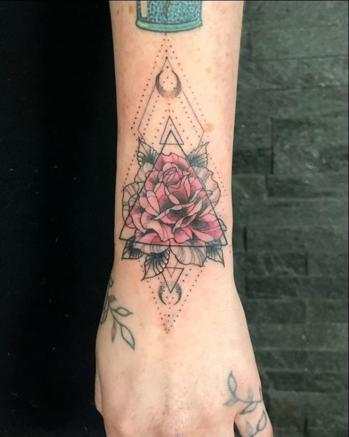 Geometric style rose tattoo on wrist